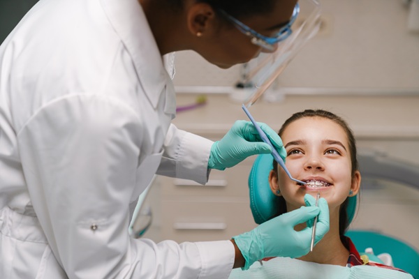 Should I Take My Child To A Kid Friendly Dentist In Swampscott For White Spots On Teeth?